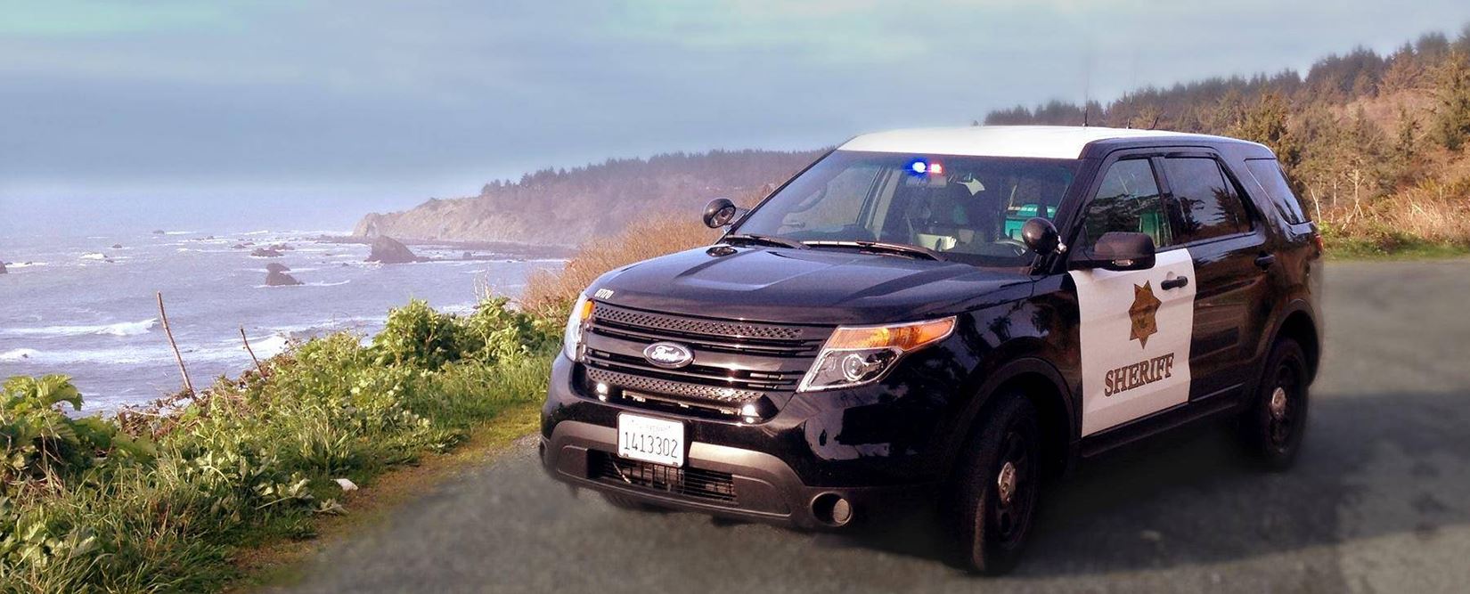 Patrol car at a beach
