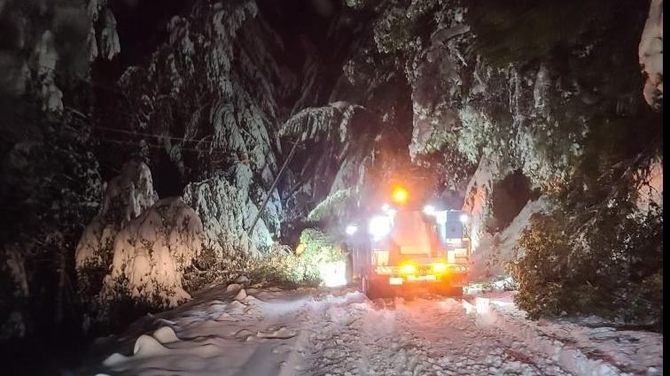 Search and rescue teams working in snow during a winter storm