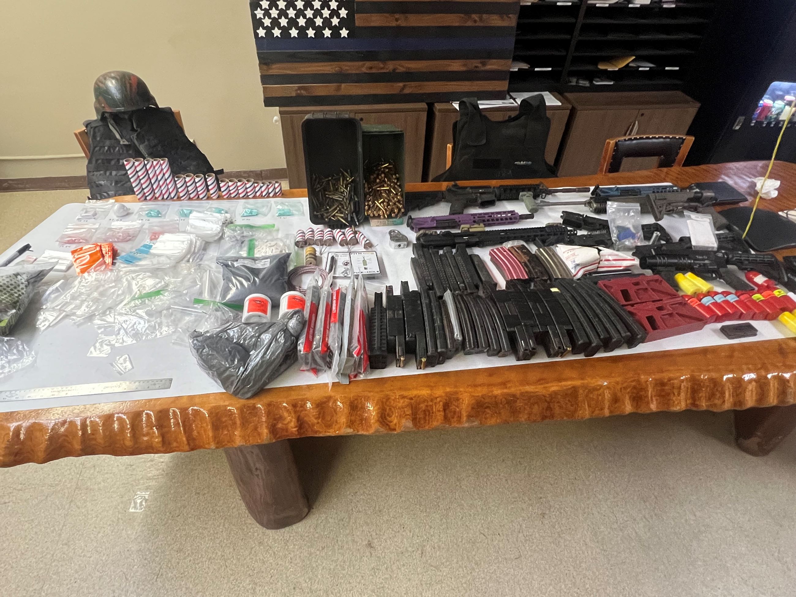 Guns, drugs, ammunition and bomb making materials recovered during the search warrant