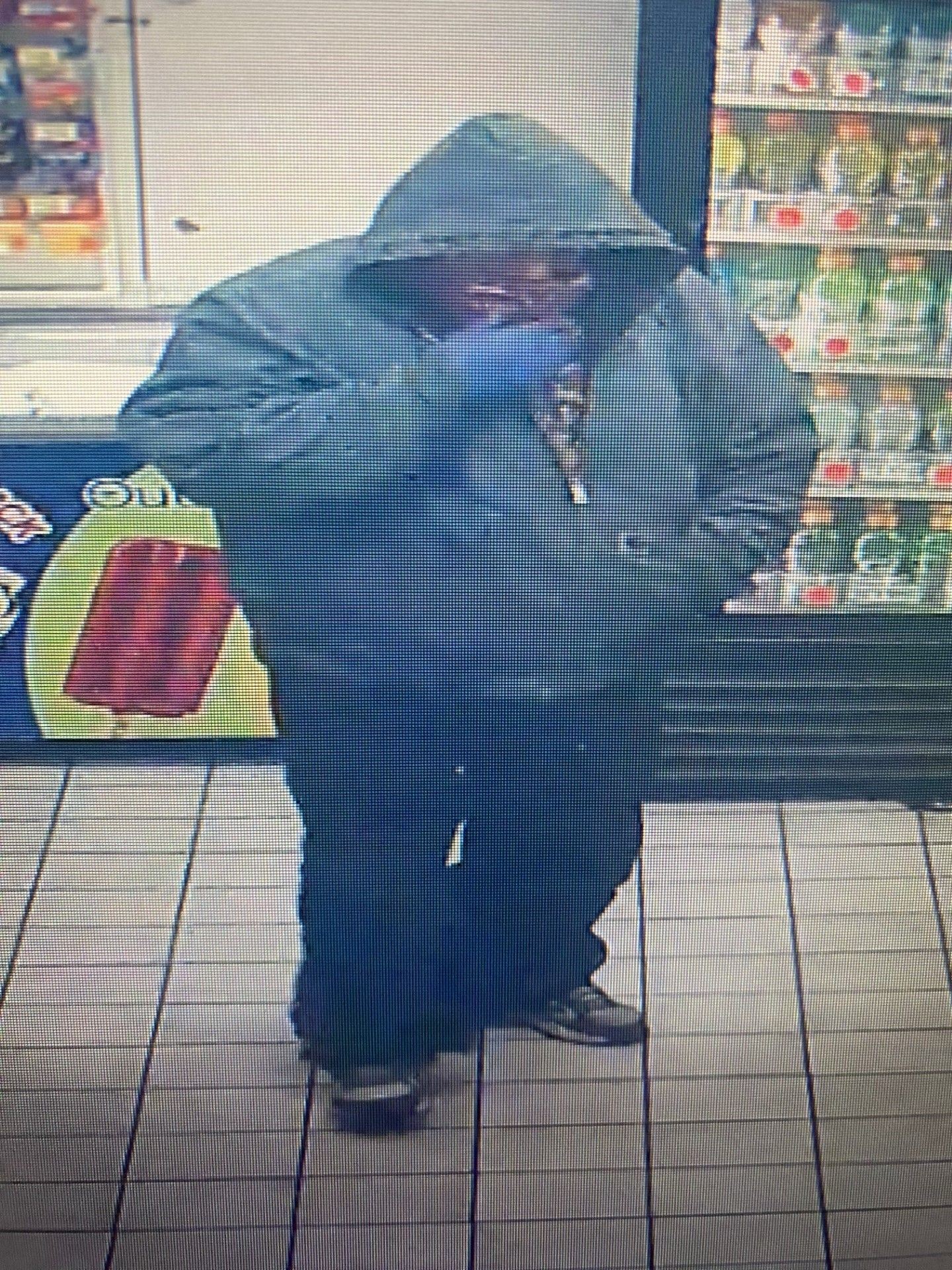 Robbery suspect described as a heavyset male last seen wearing a red bandana over his face.