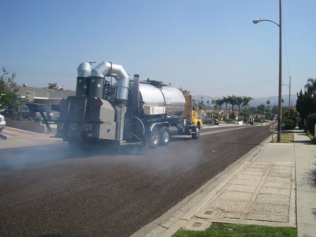 Distributor Truck applying the asphalt emulsion 