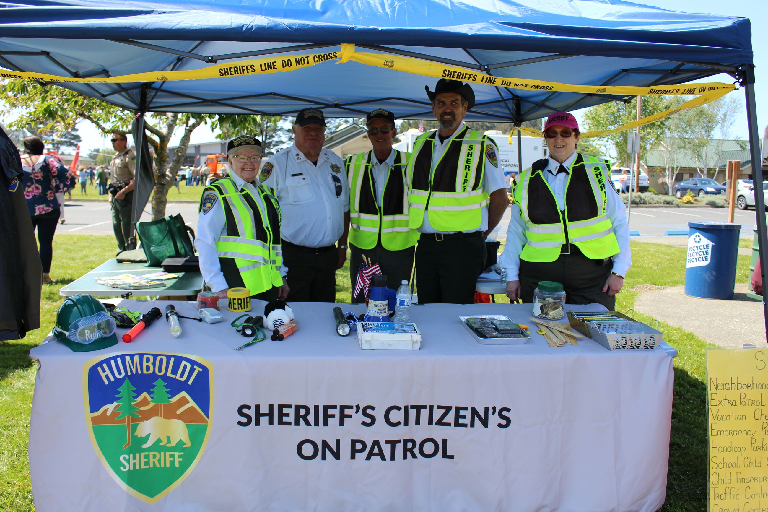 A group of SCOP Volunteers standing behind a table