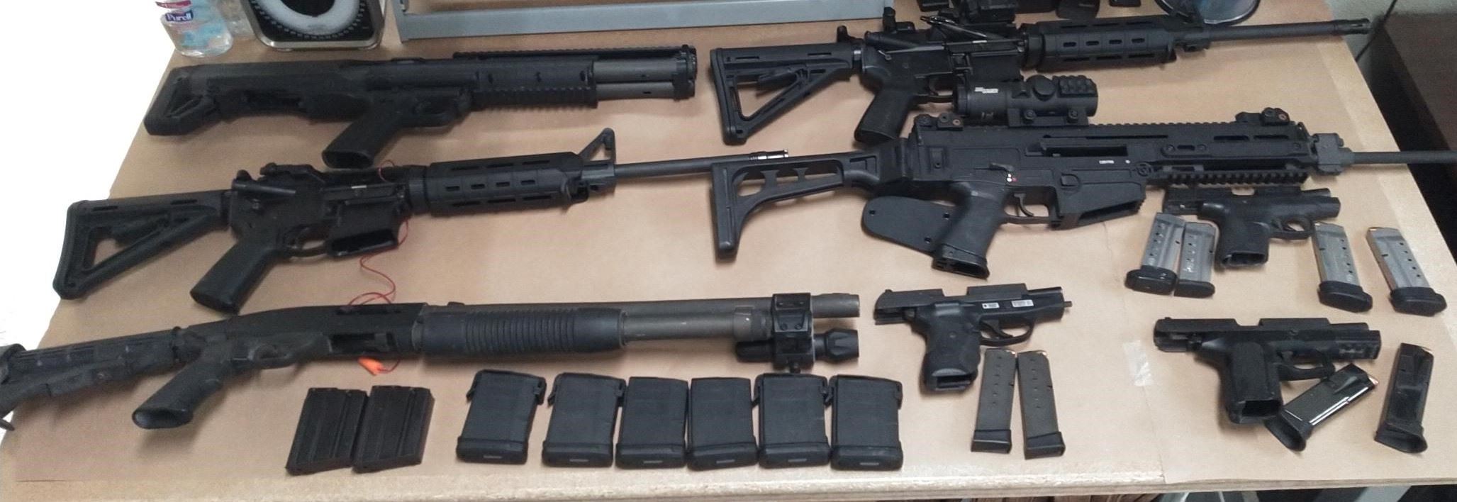 Eight black firearms located during search warrant